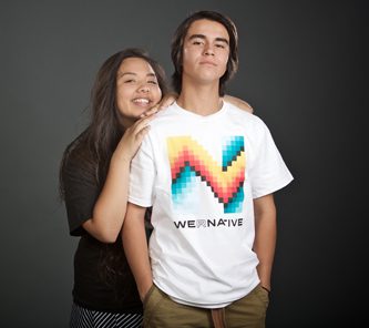 two young individuals posing for picture wearing We R Native t-shirt