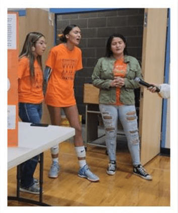 Native American girls being interviewed.