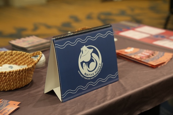 booklet with logo sitting on a table